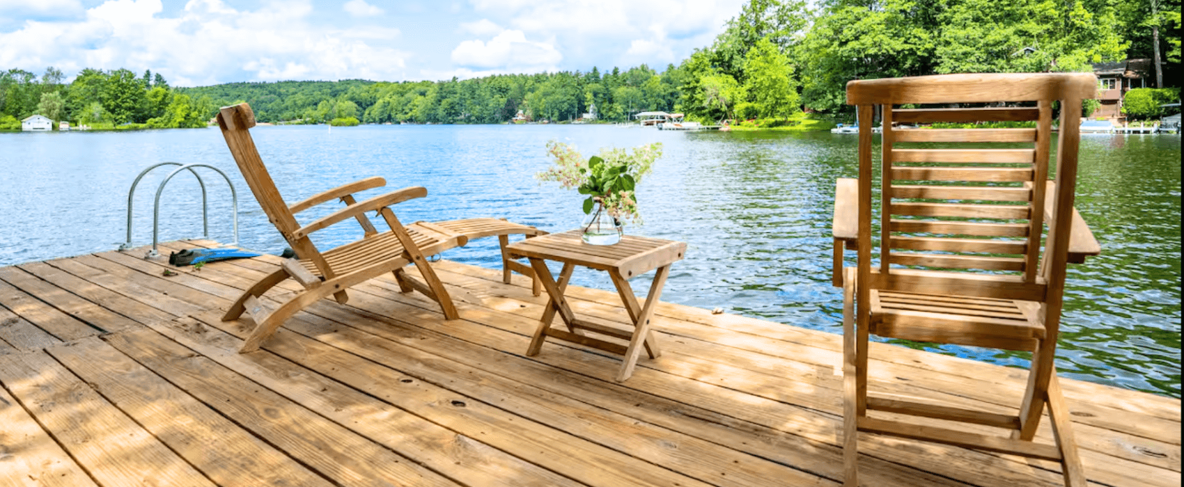 Lakeside dock with teak loungers on a Berkshires lake